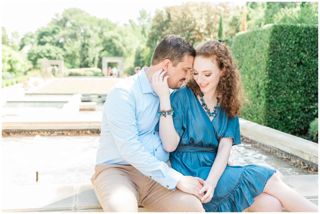 engaged couple at dallas arboretum in a woman's garden