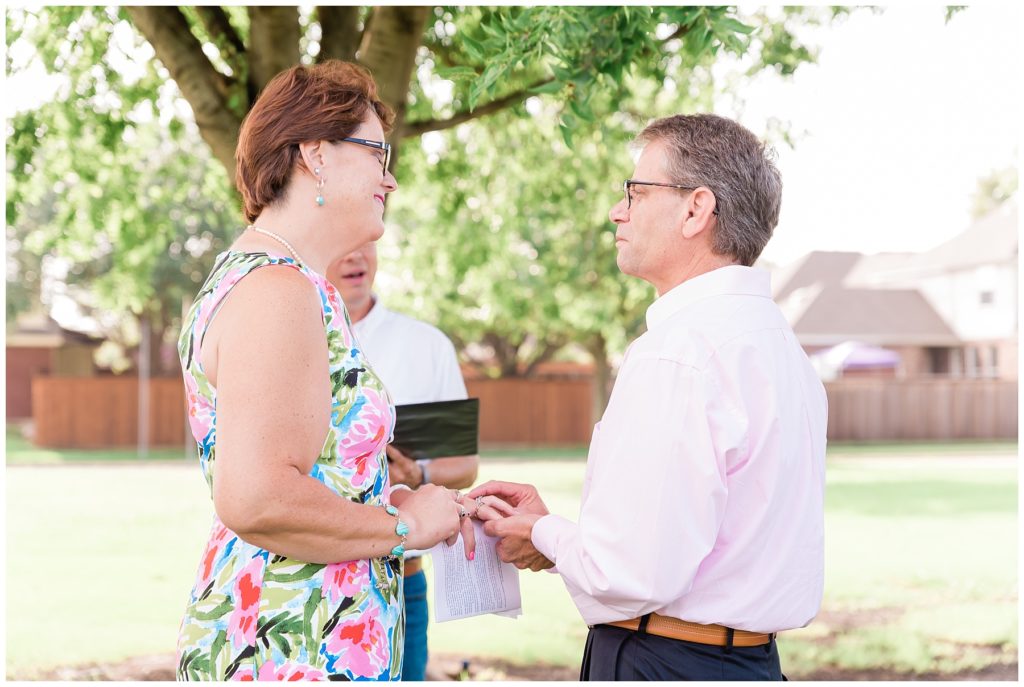 exchanging rings at 25th anniversary vow renewal
