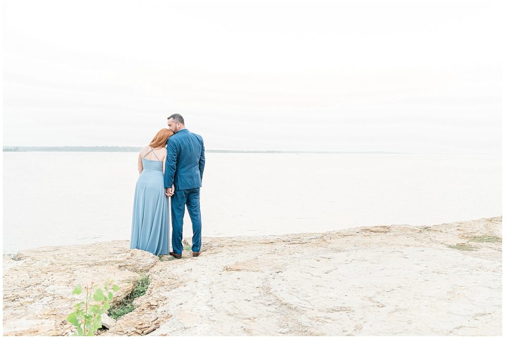 couple overlooking water on cliff at rockledge park grapevine texas blue dress blue suit