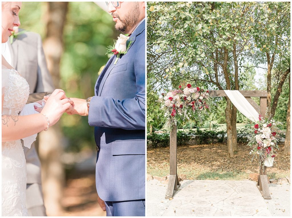 bride and groom exchanging rings rustic arch with dahlia and rose floral sprays