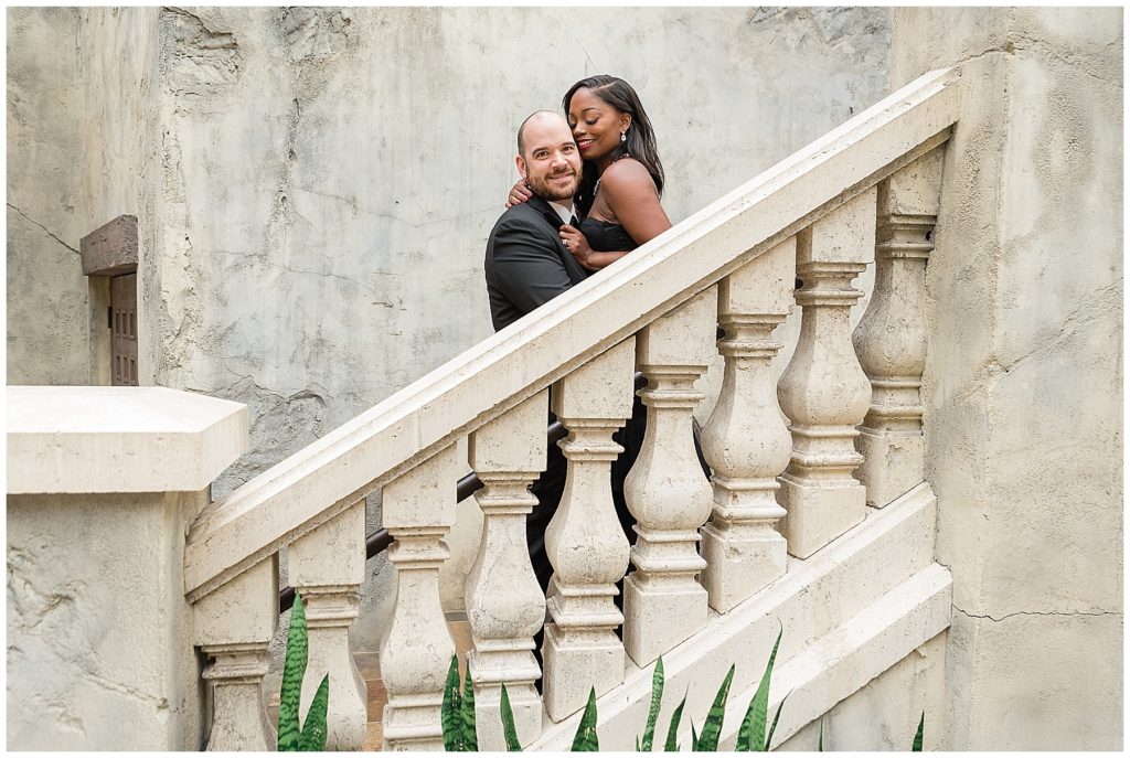 husband and wife luxury anniversary session on white marble stairs