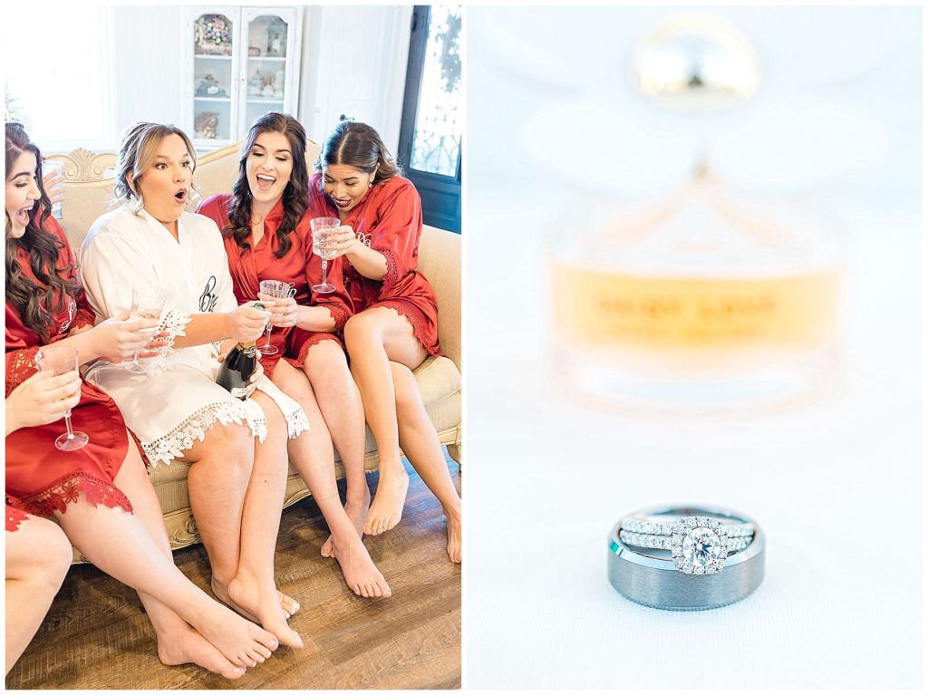 bride and bridesmaids in matching robes popping a champagne bottle wedding bands in front of Marc Jacobs Daisy perfume bottle