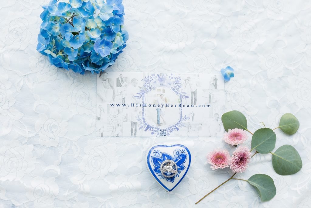 bride's details and wedding ring on blue ring box