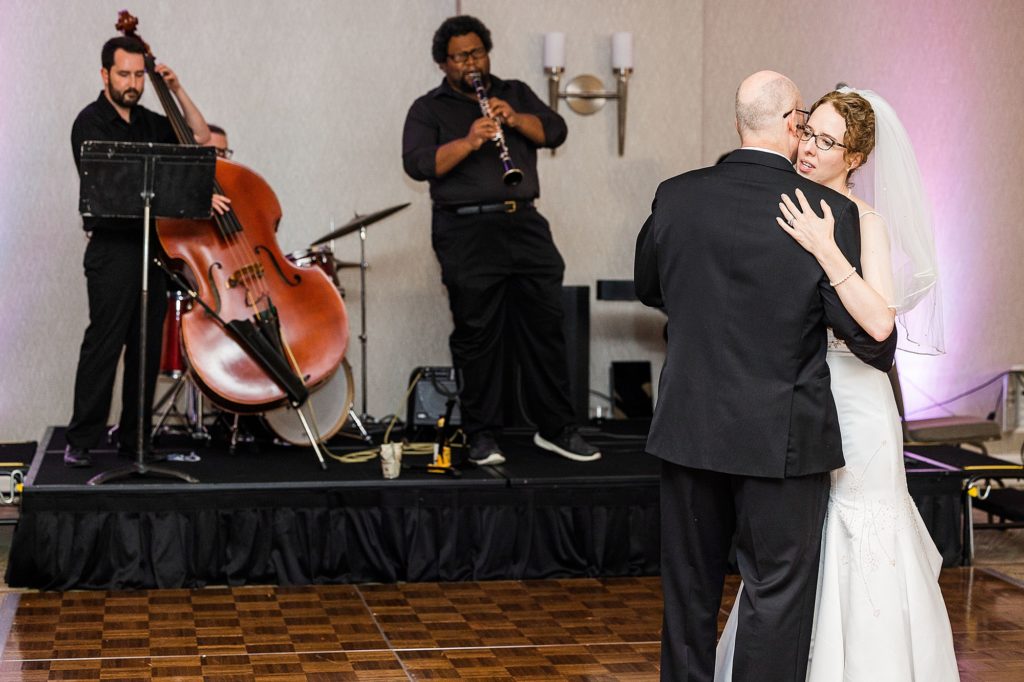 newlyweds have first dance with live band at Dallas Addison Marriott