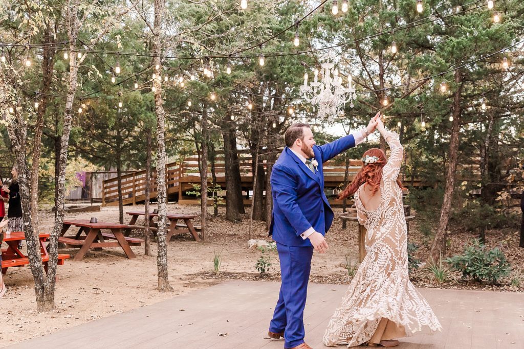 groom twirls bride during reception at Oak Meadow Ranch