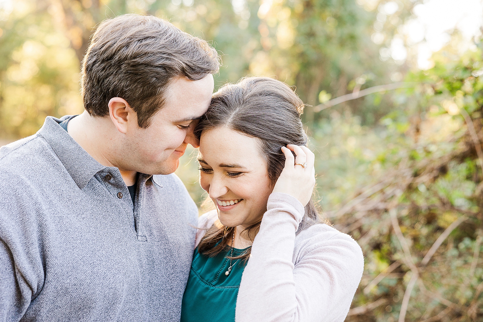 bride and groom laugh during engagement session in the fall