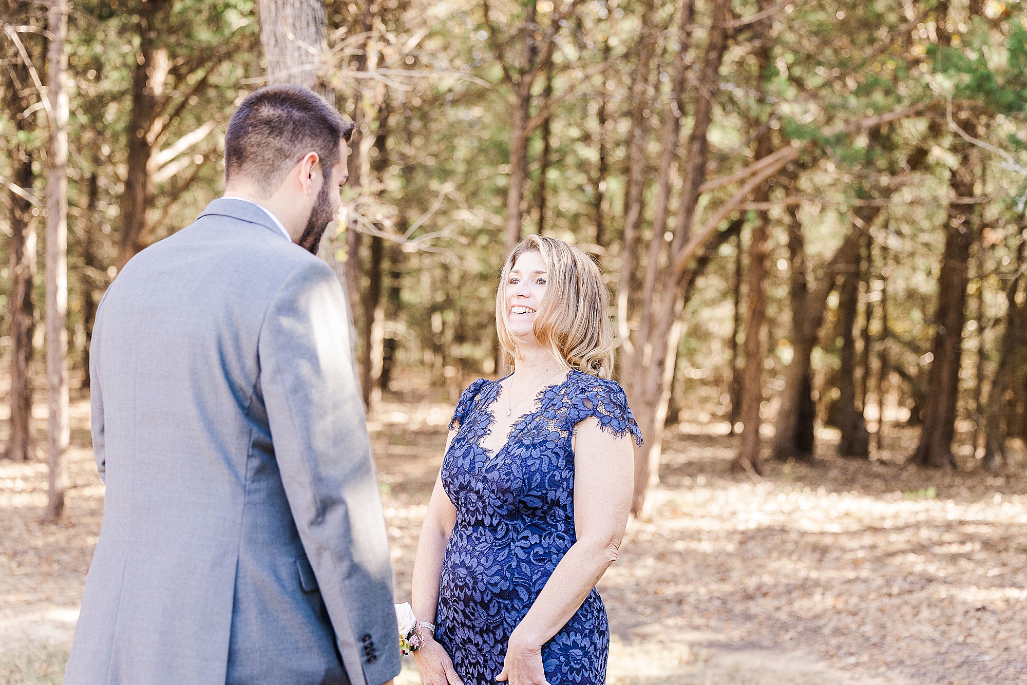 groom and mom have first look before Whispering Oaks wedding