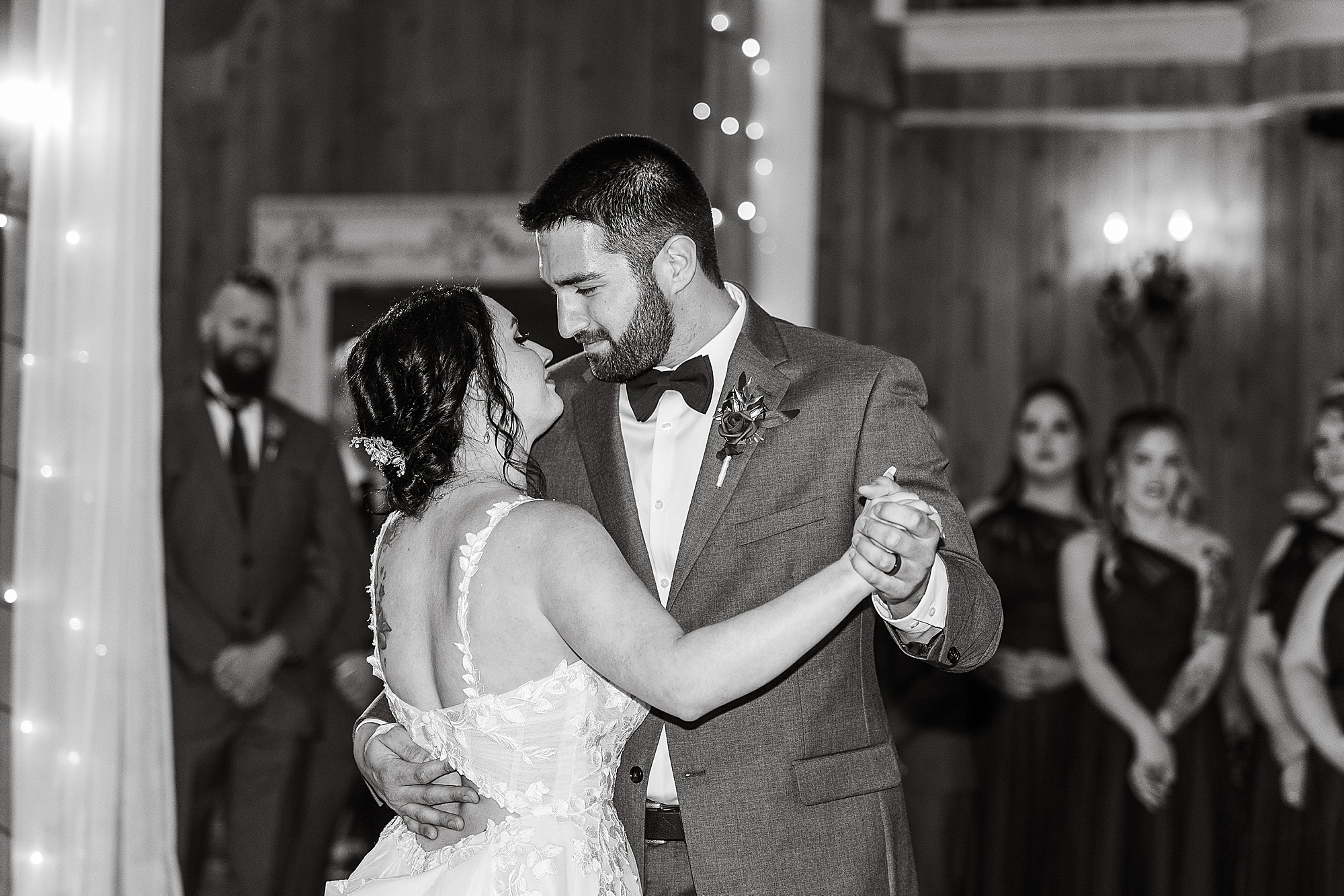 groom looks at bride during first dance