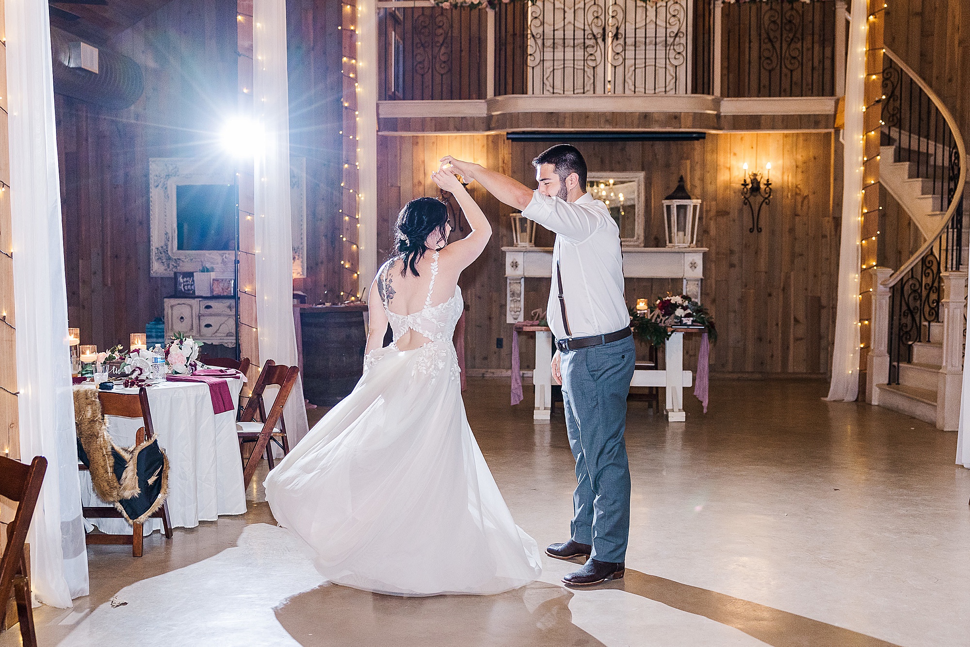 groom twirls bride during last dance