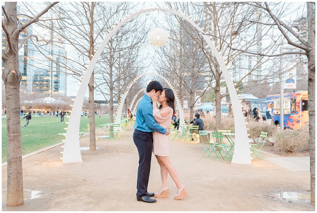 anniversary session engagement session at klyde warren park dallas texas archways food trucks giggle kiss foot pop