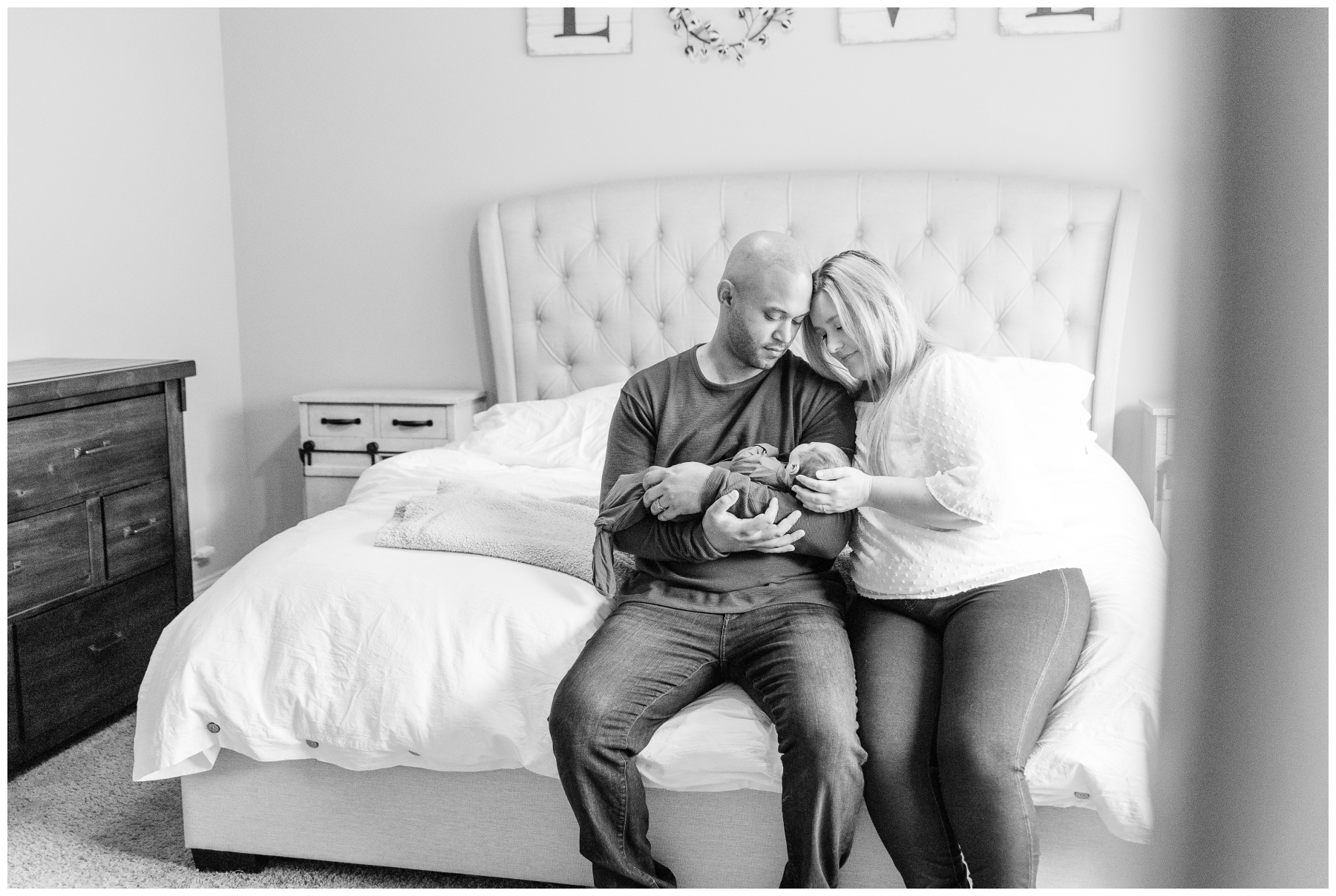 parents snuggle with baby boy during Frisco lifestyle newborn session