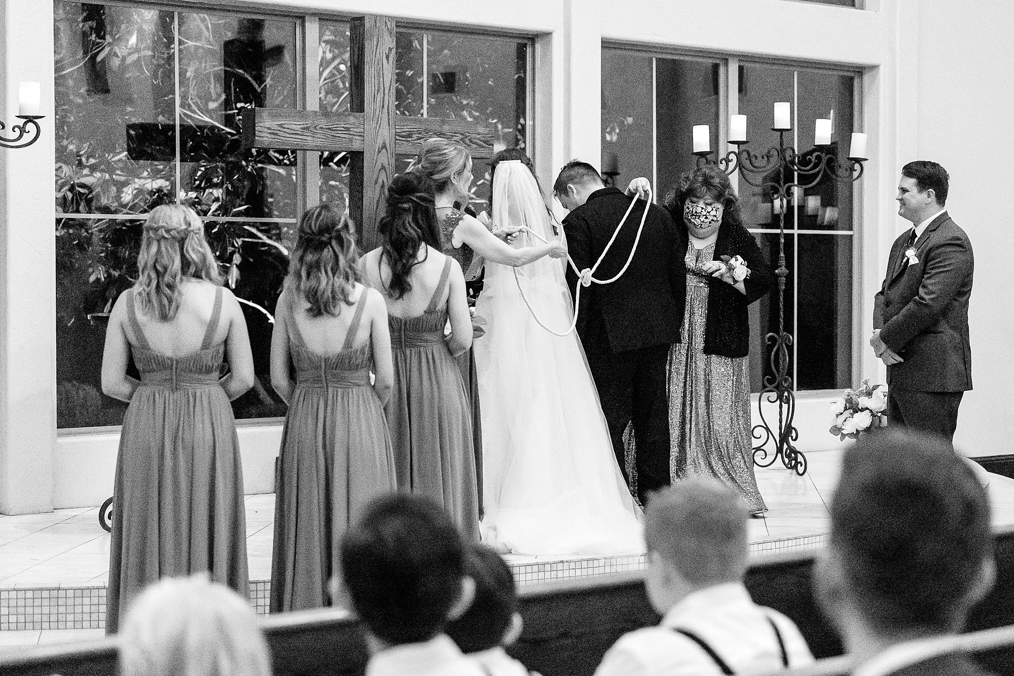 mothers lay lasso over bride and groom during wedding ceremony at the Chapel at Ana Villa