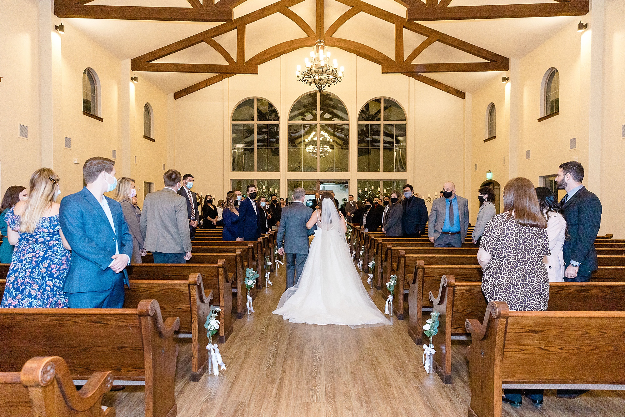 bride walks down aisle with dad during ceremony at the Chapel at Ana Villa