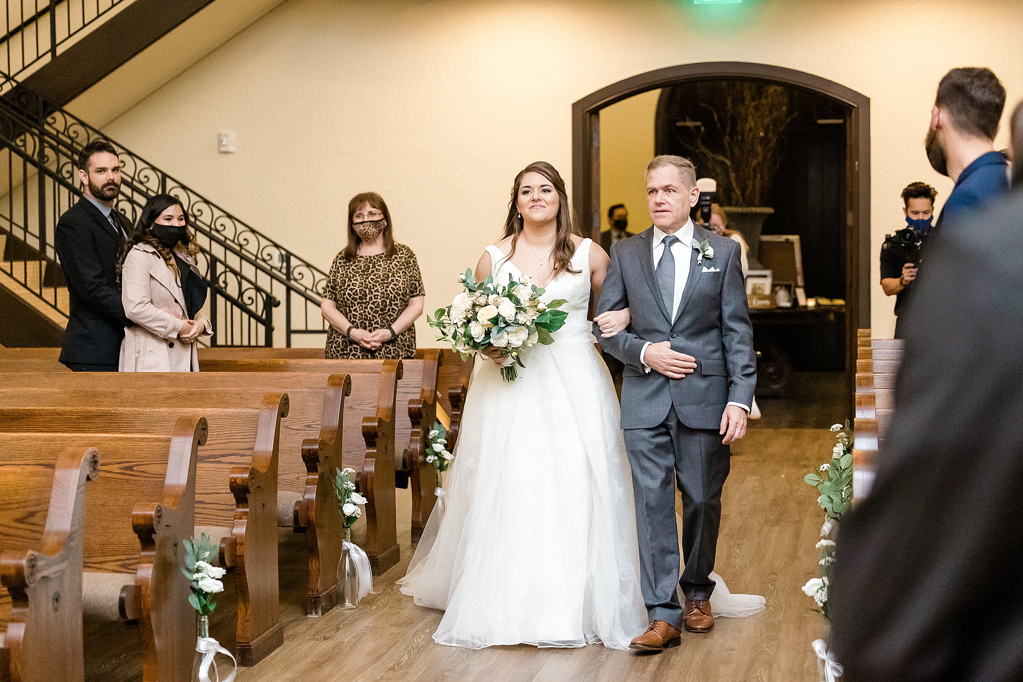 bride walks down aisle with father at wedding ceremony at the Chapel at Ana Villa