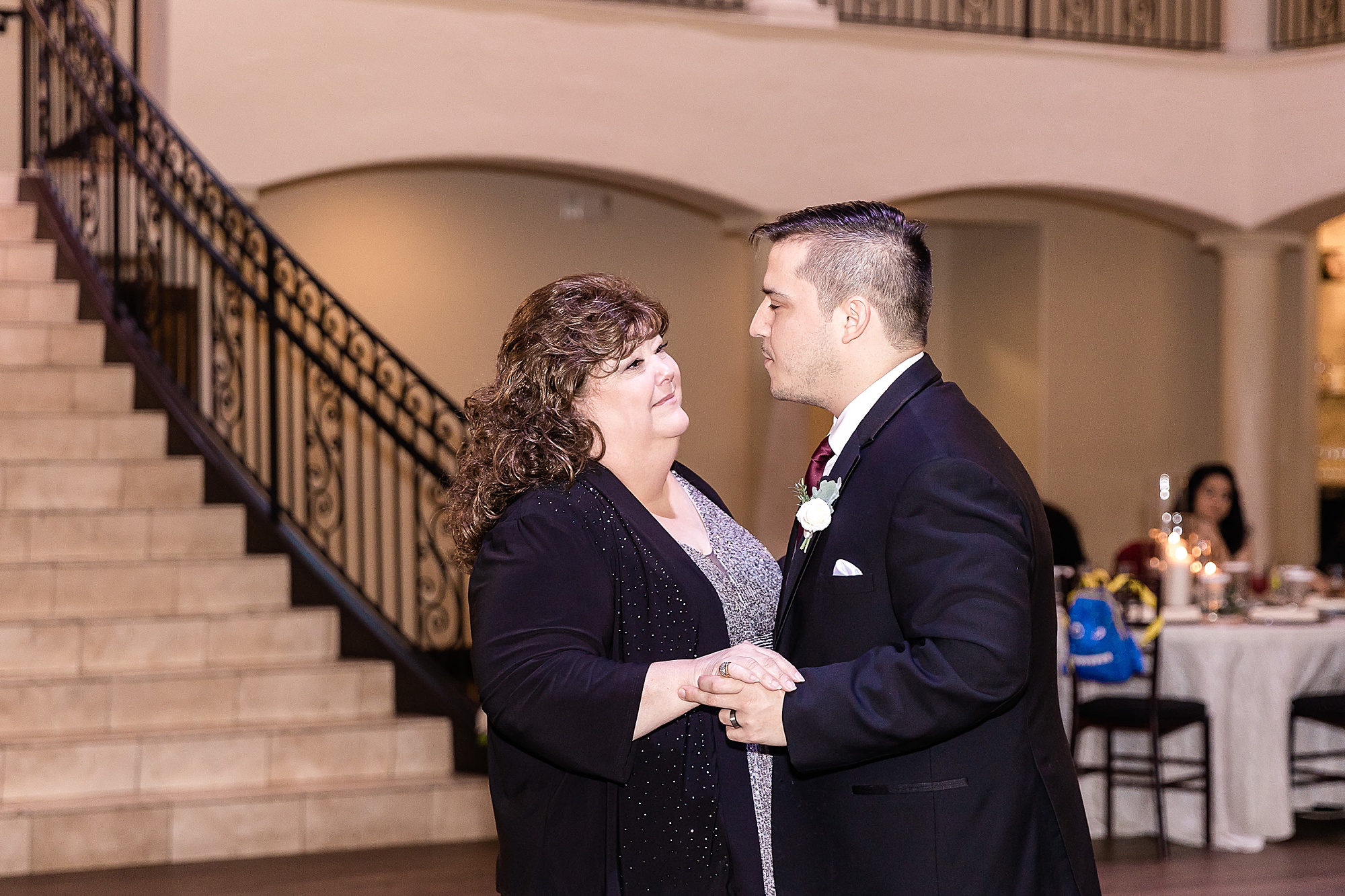 groom and mom dance during Texas wedding reception
