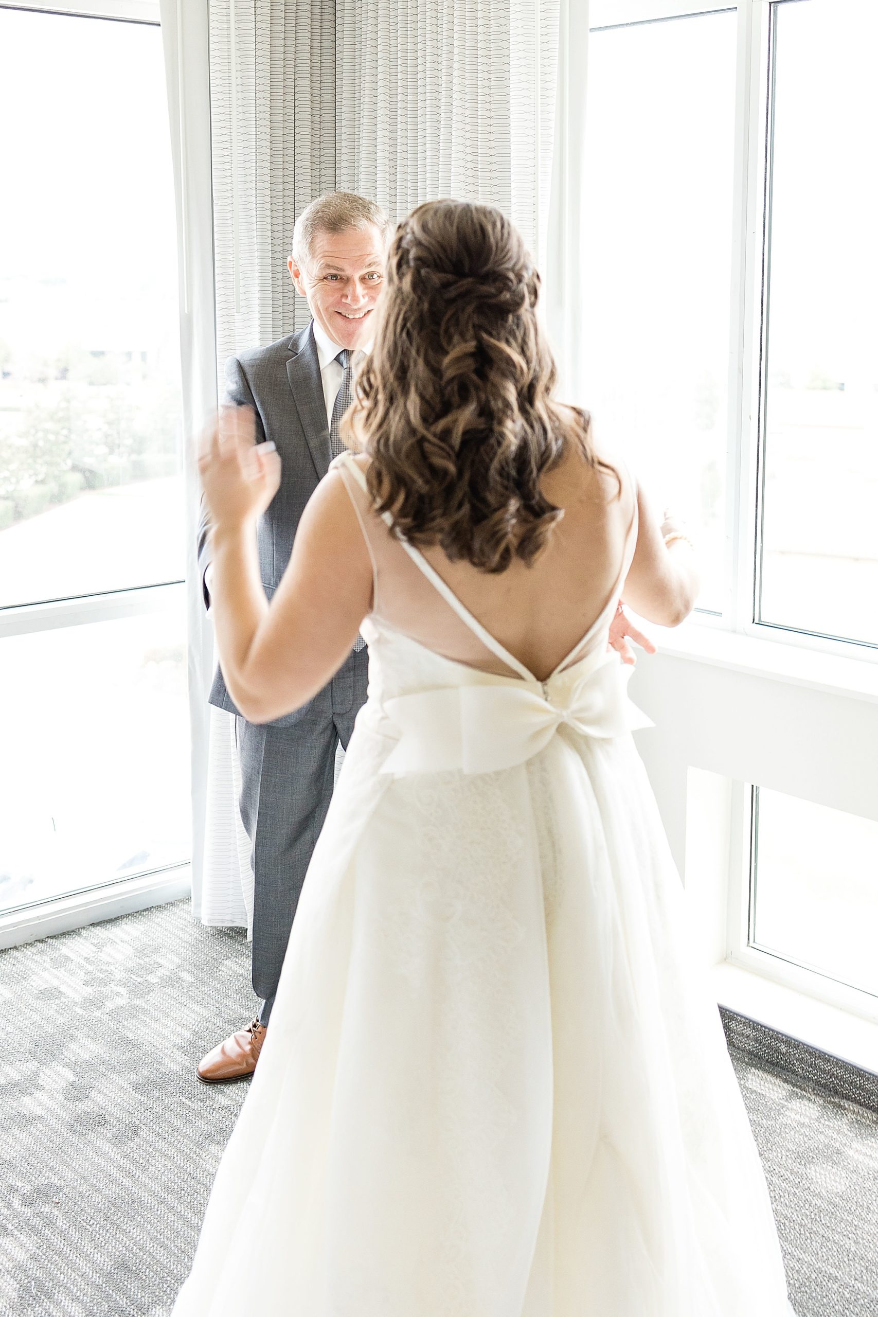 bride and father have first look at Courtyard Marriott in Colony TX
