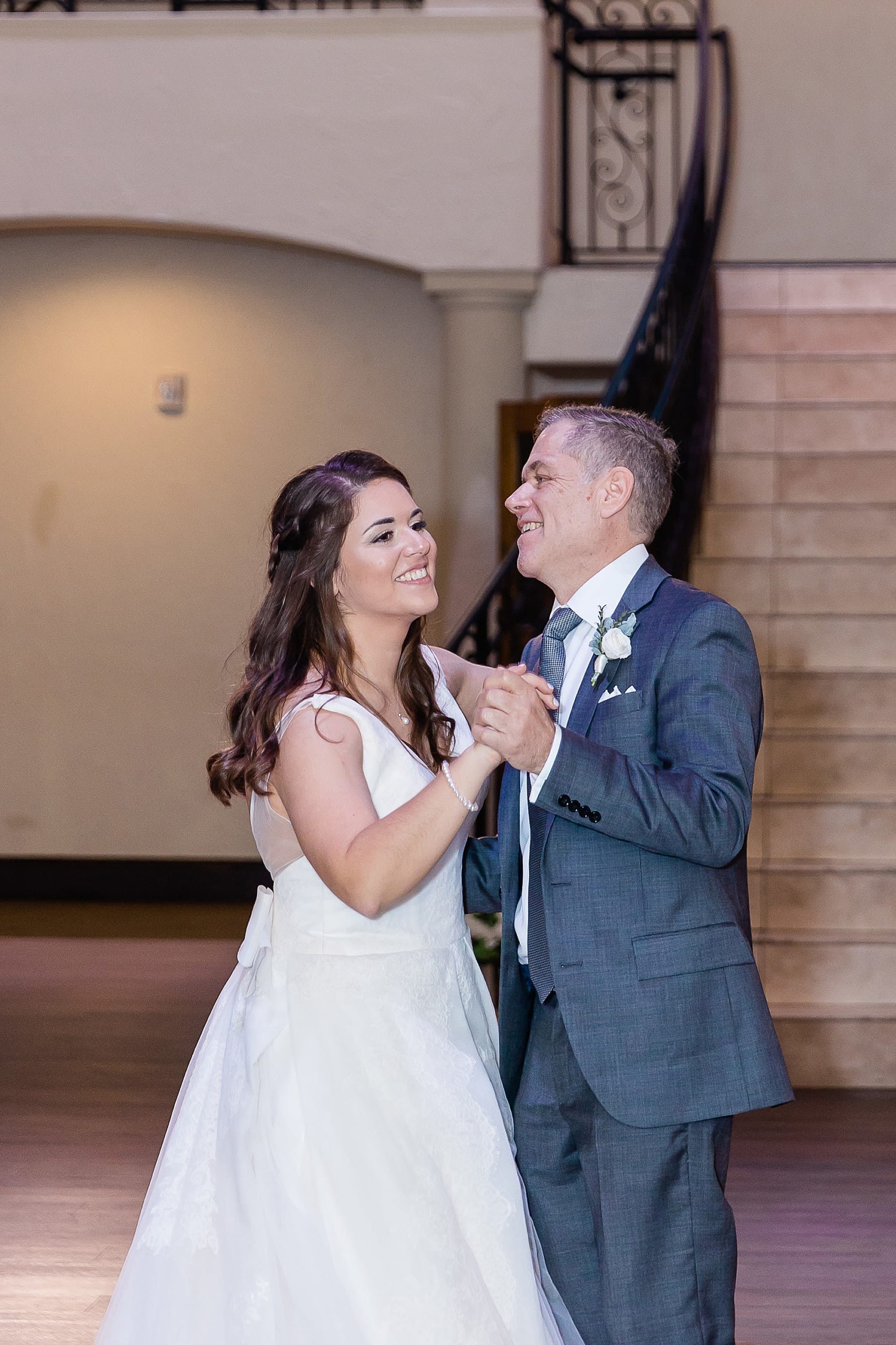bride and dad dance together during Texas wedding reception