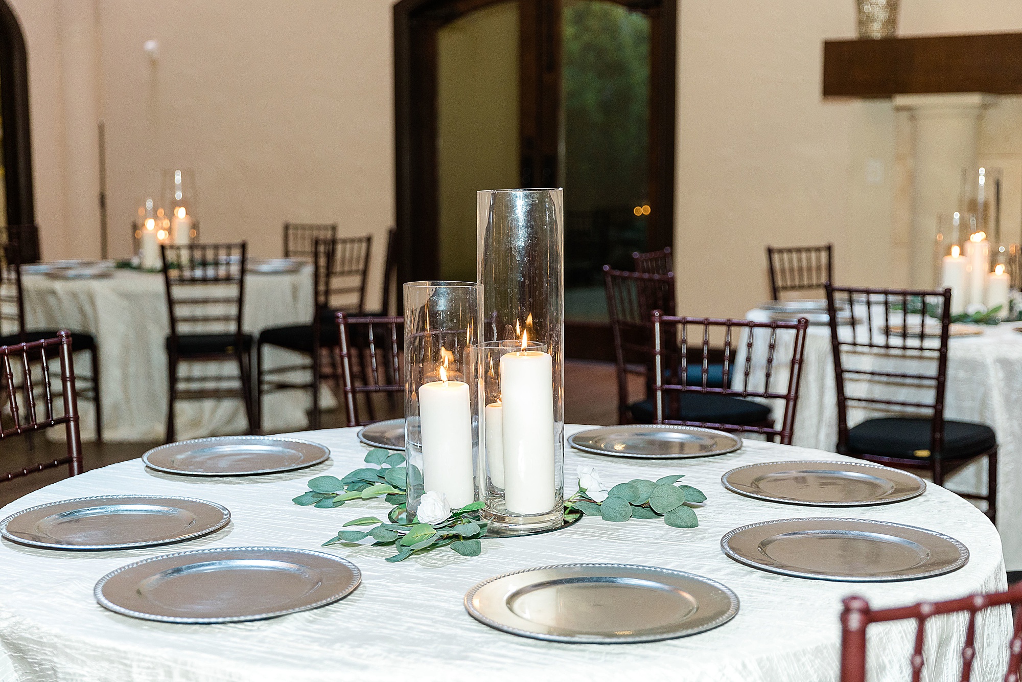 centerpieces with tall pillar candles 
