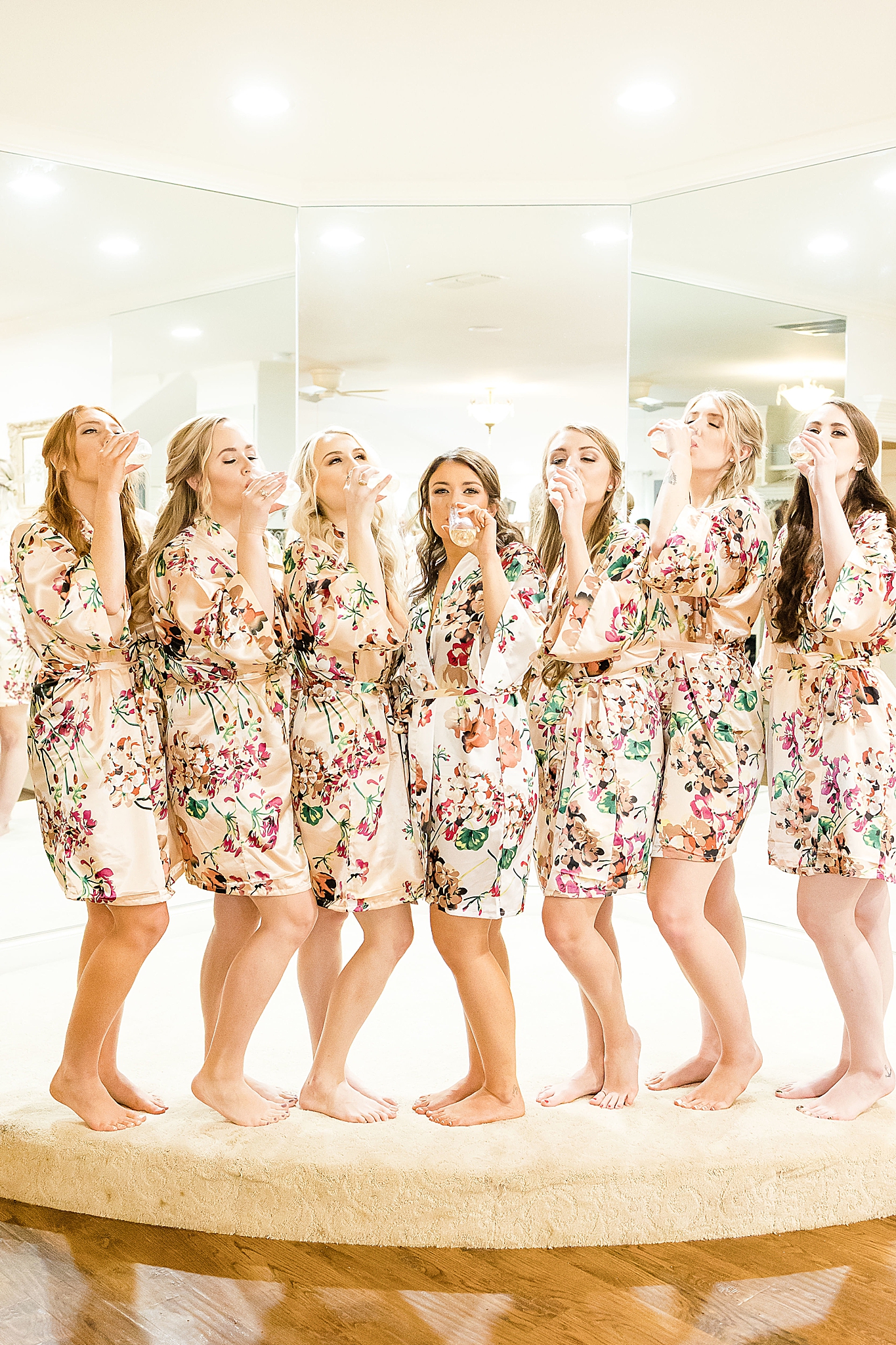 bridesmaids have champagne toast before Hidden Waters wedding