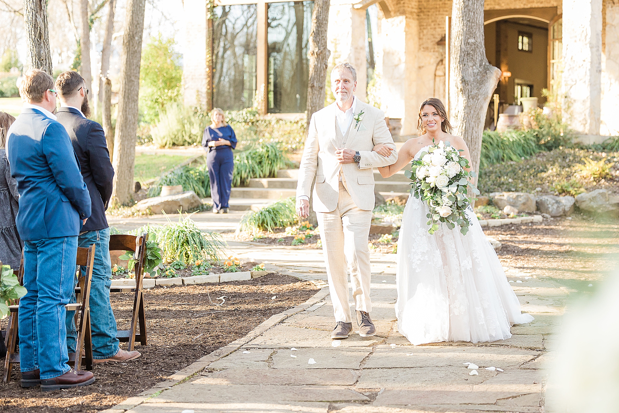 bride and grandfather walk down aisle together