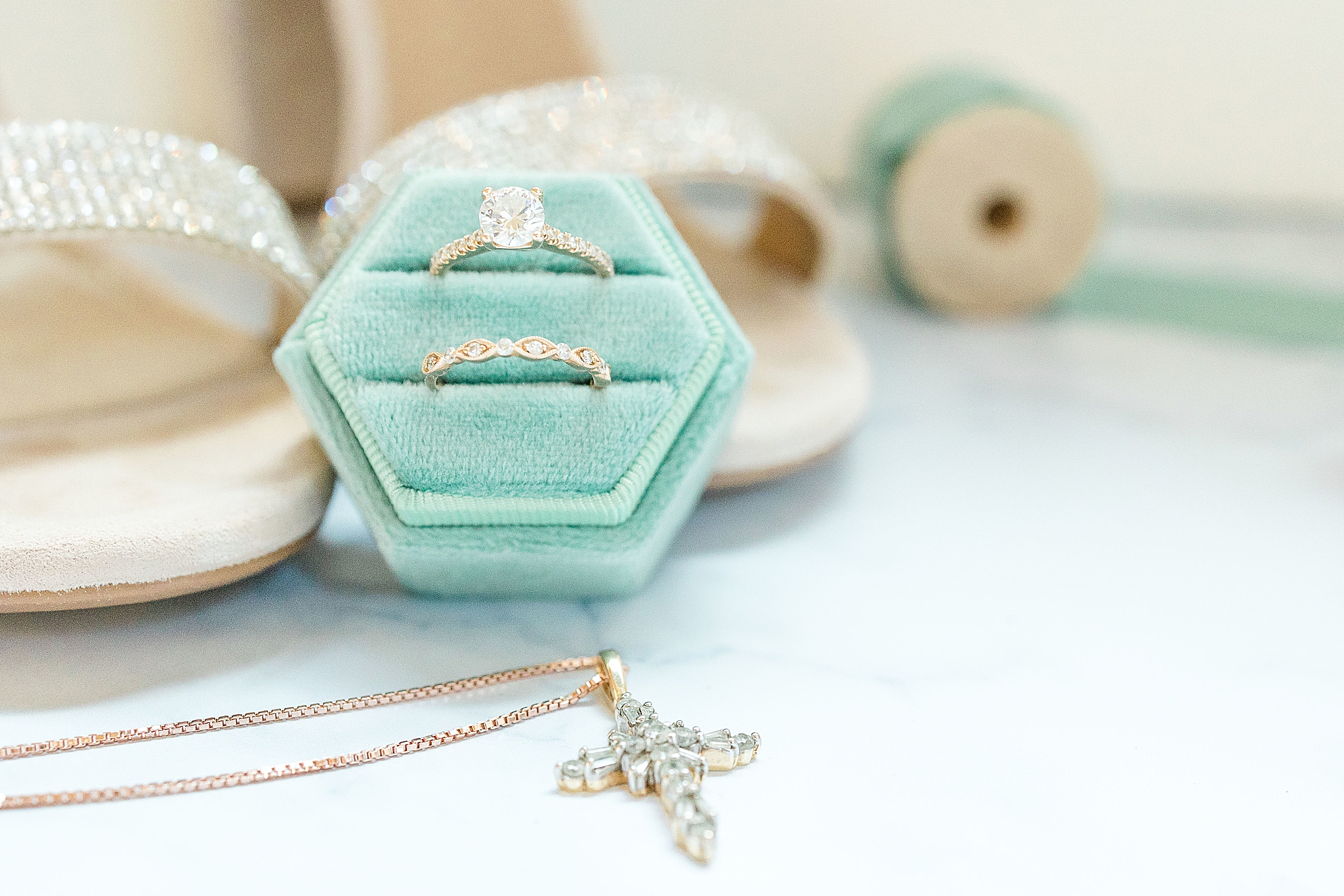 bride's wedding bands in teal box