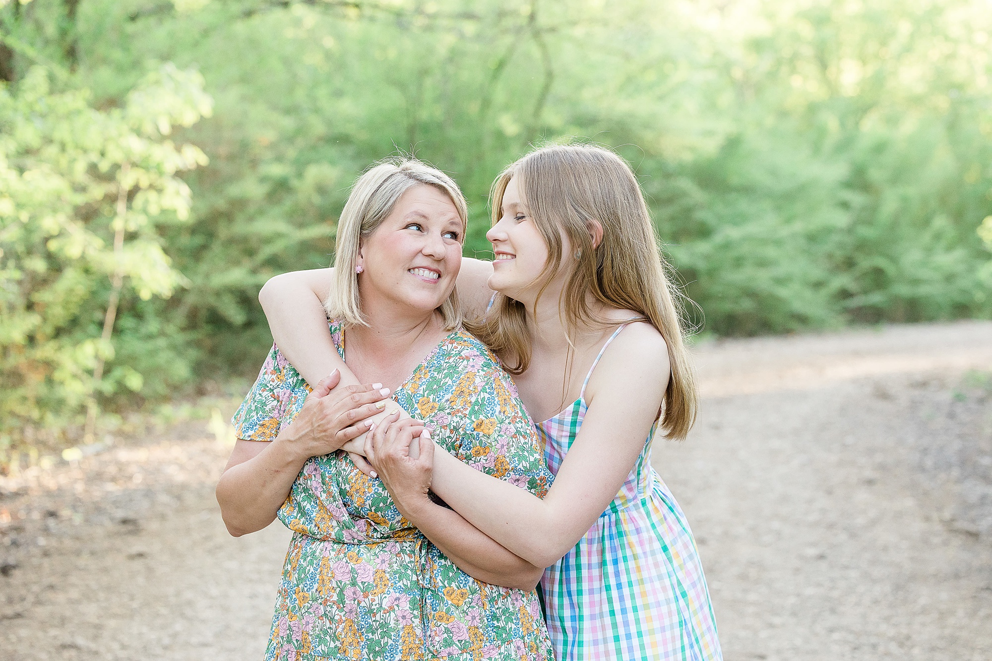 daughter hugs mom during family photos in Texas