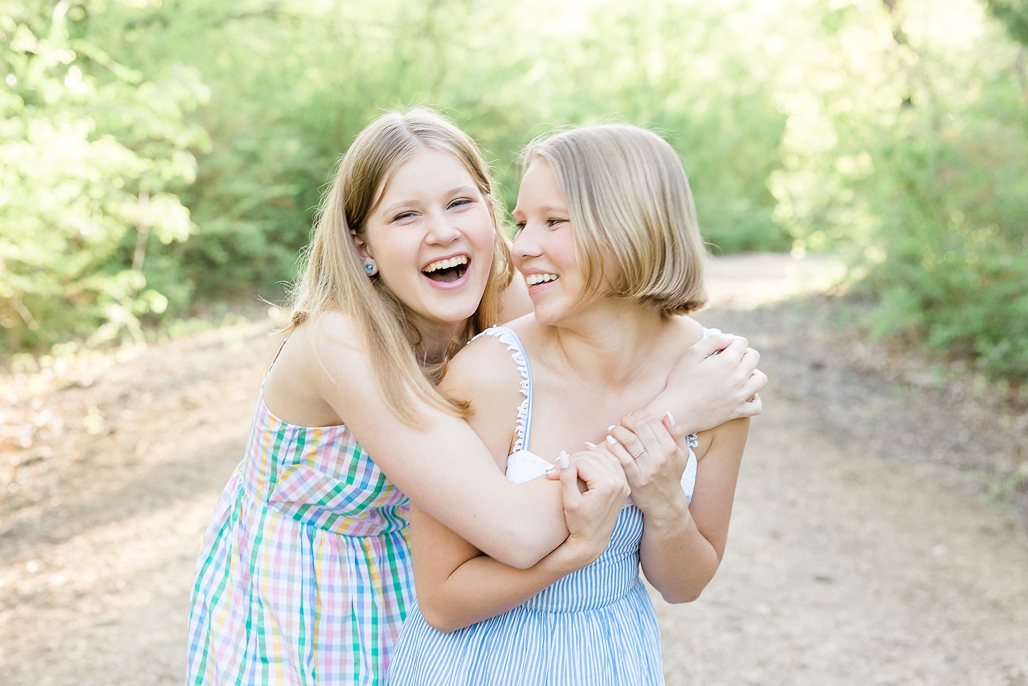 teenage sisters hug during TX family photos
