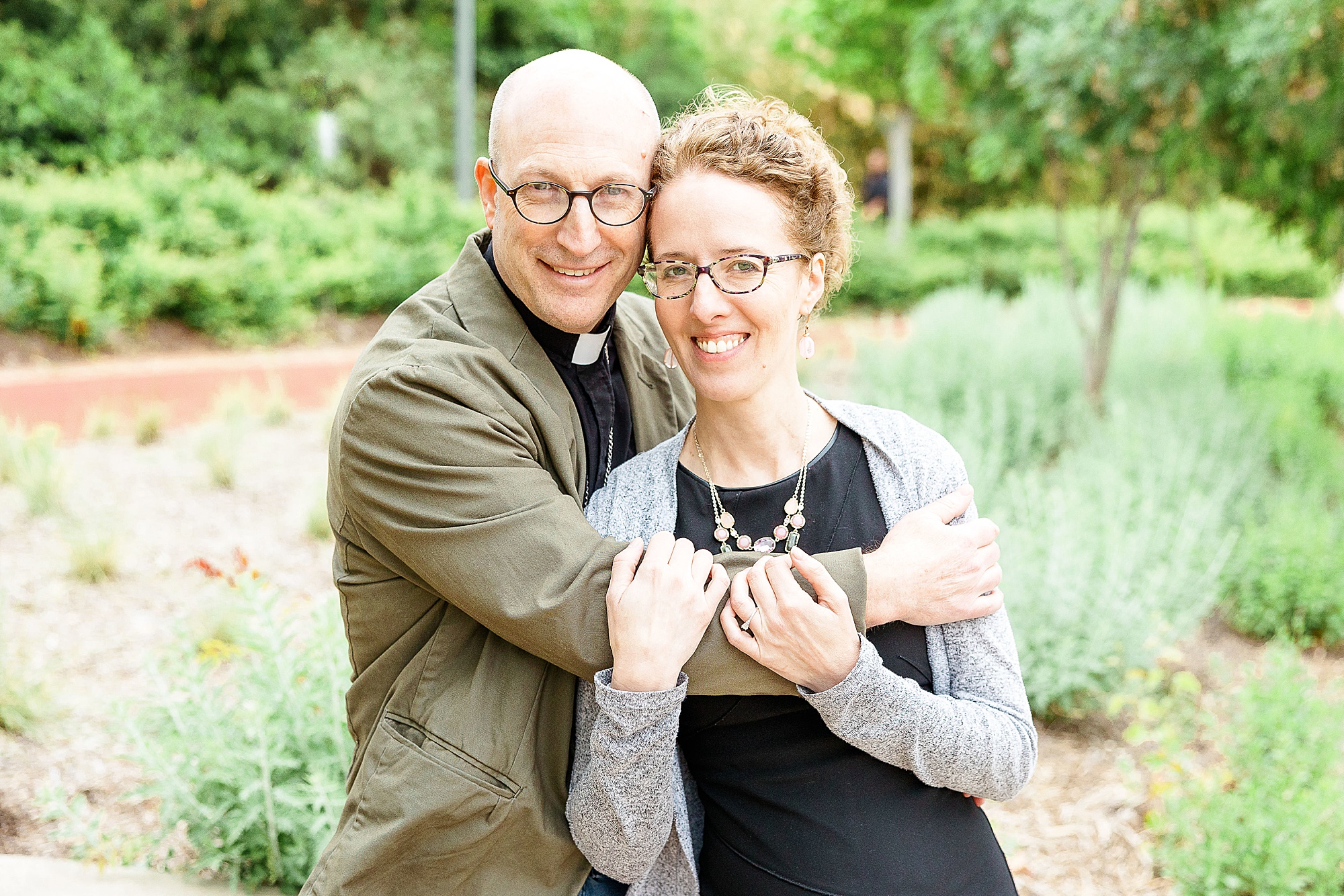 couple hugs on Katy Trail during engagement photos