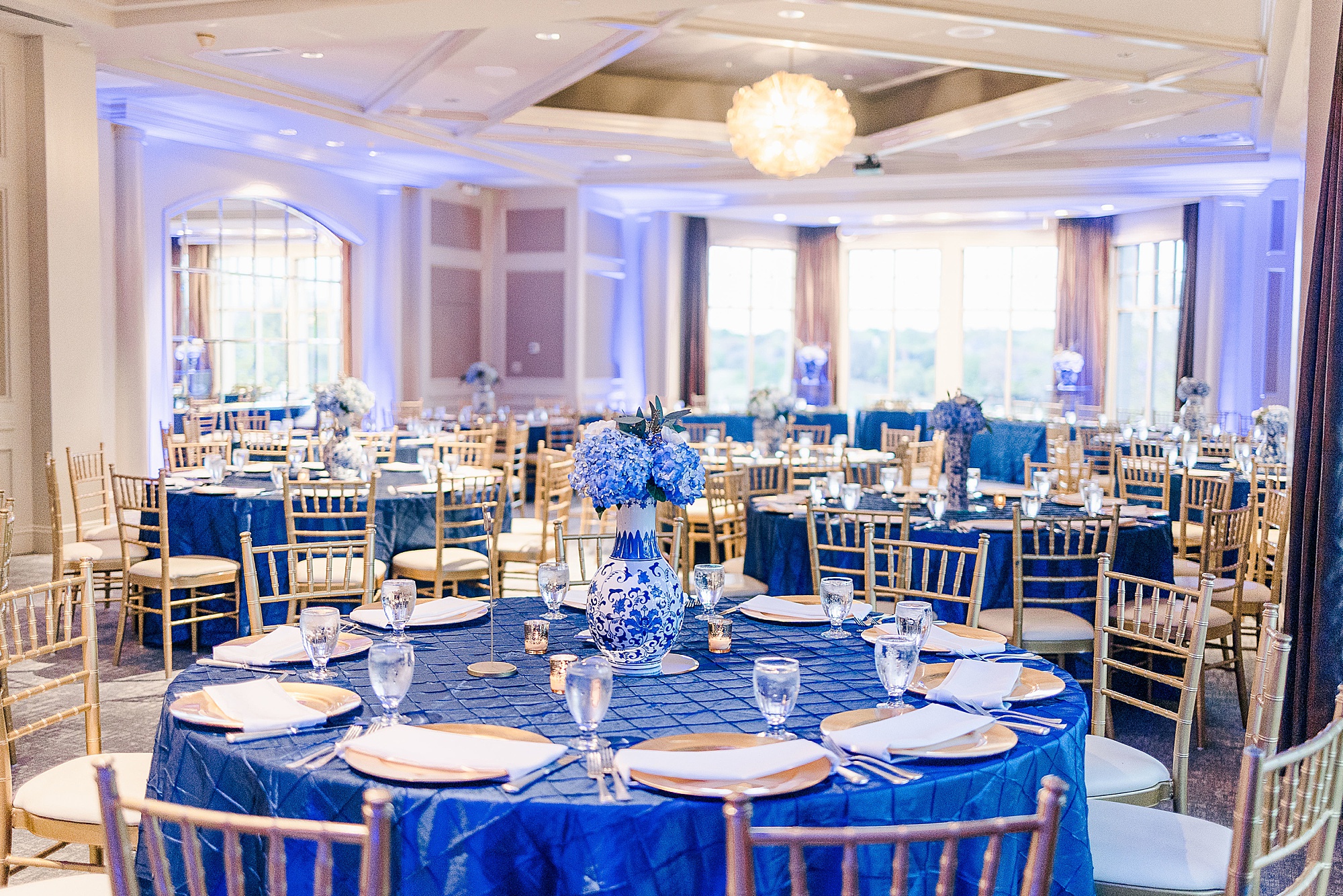 seating with blue table cloths for Frisco TX wedding reception
