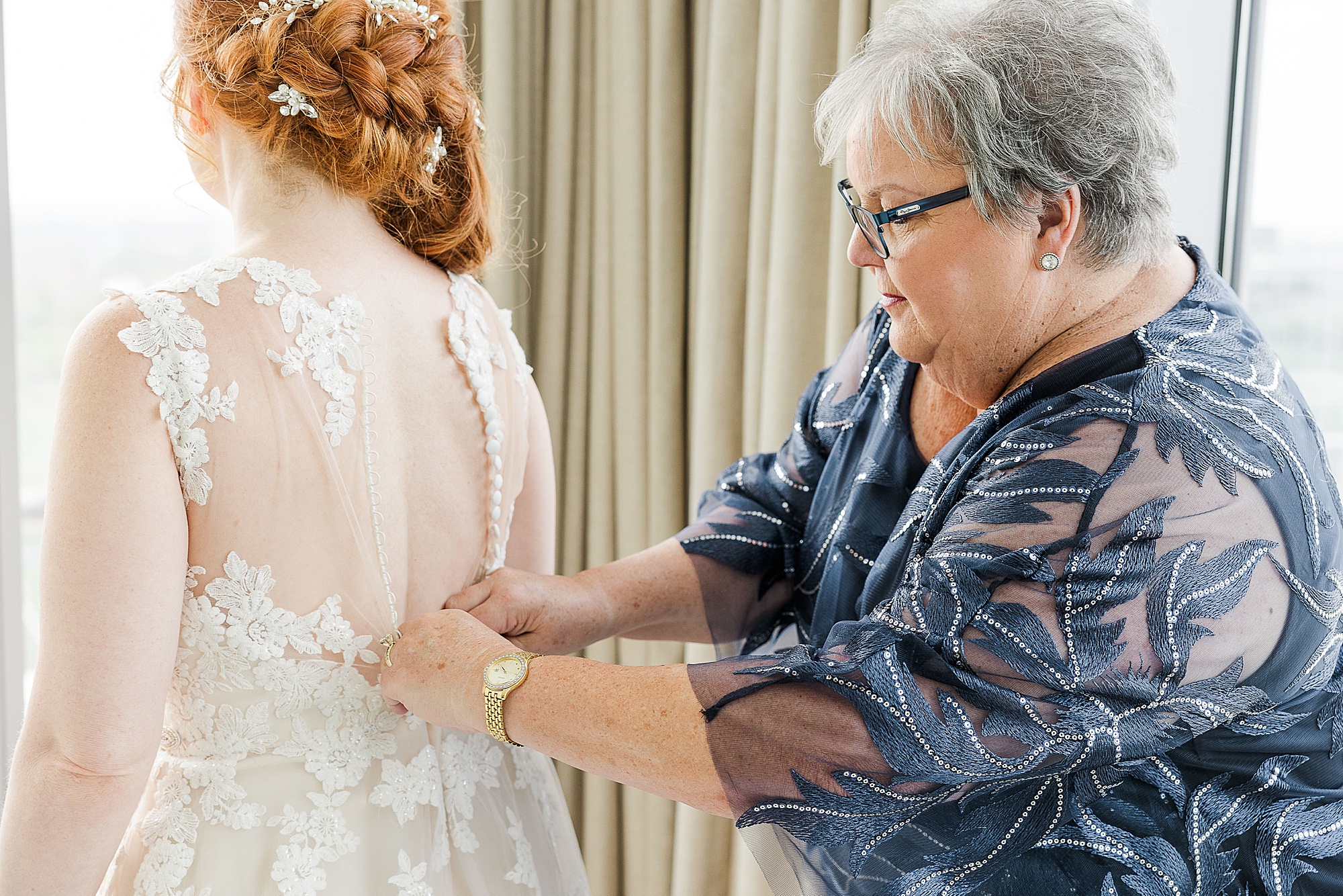 mother helps bride with wedding dress before Stonebriar Country Club wedding