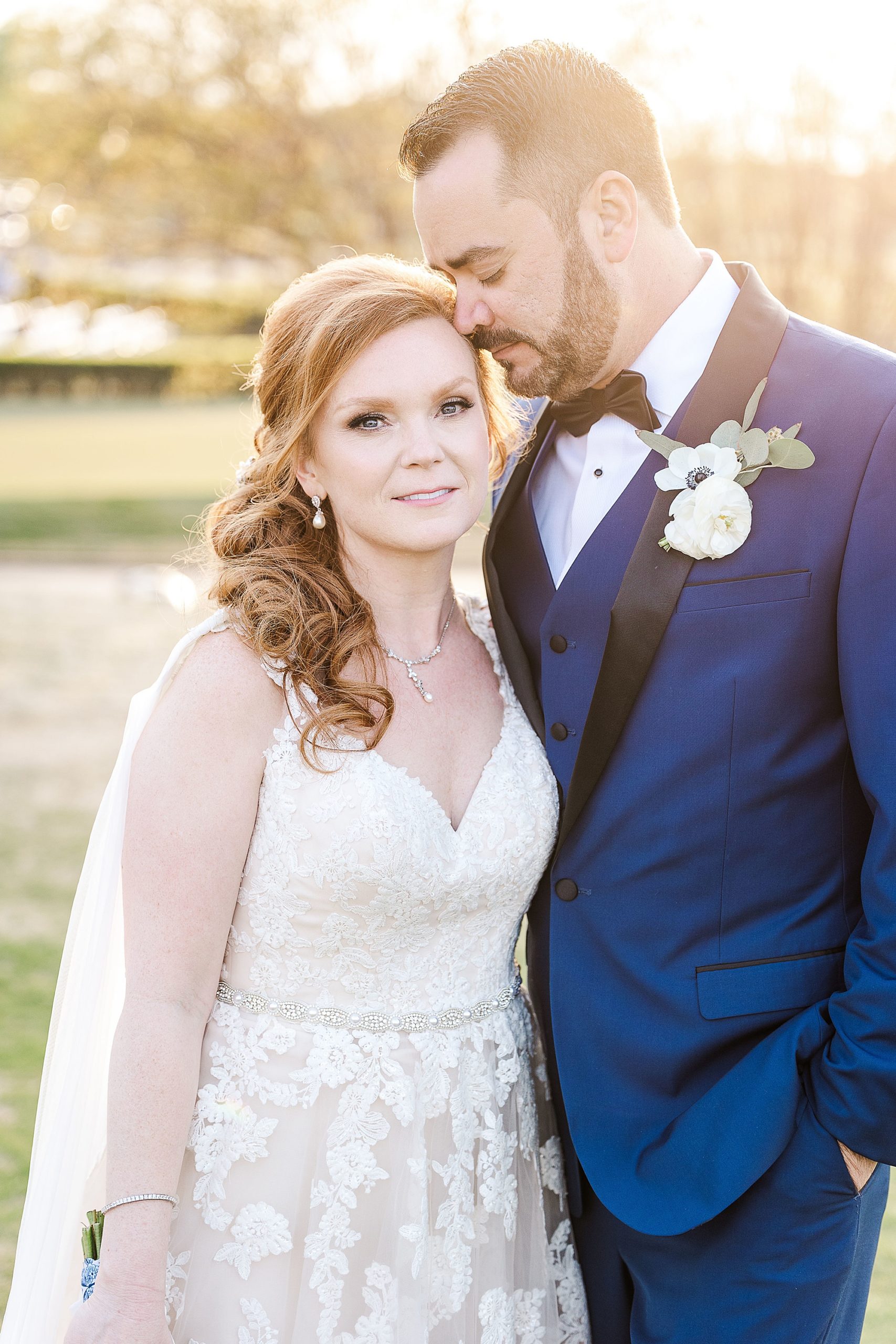 groom nuzzles bride's forehead during TX wedding photos