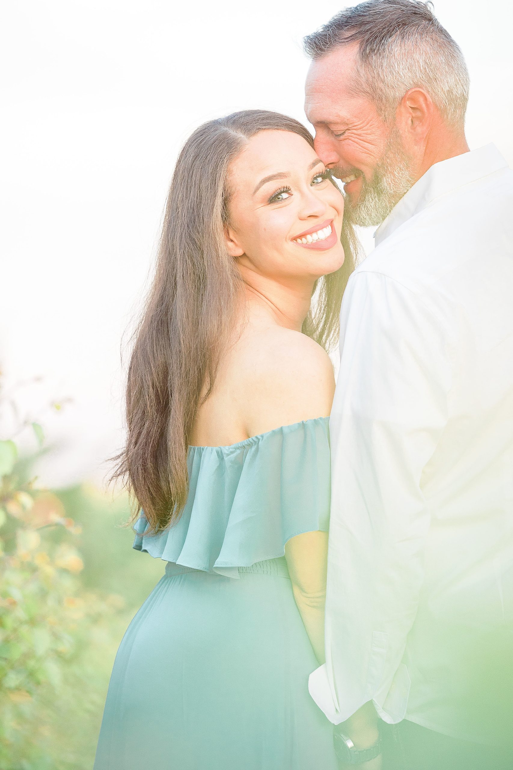 bride and groom pose during Adriatica Village engagement session 