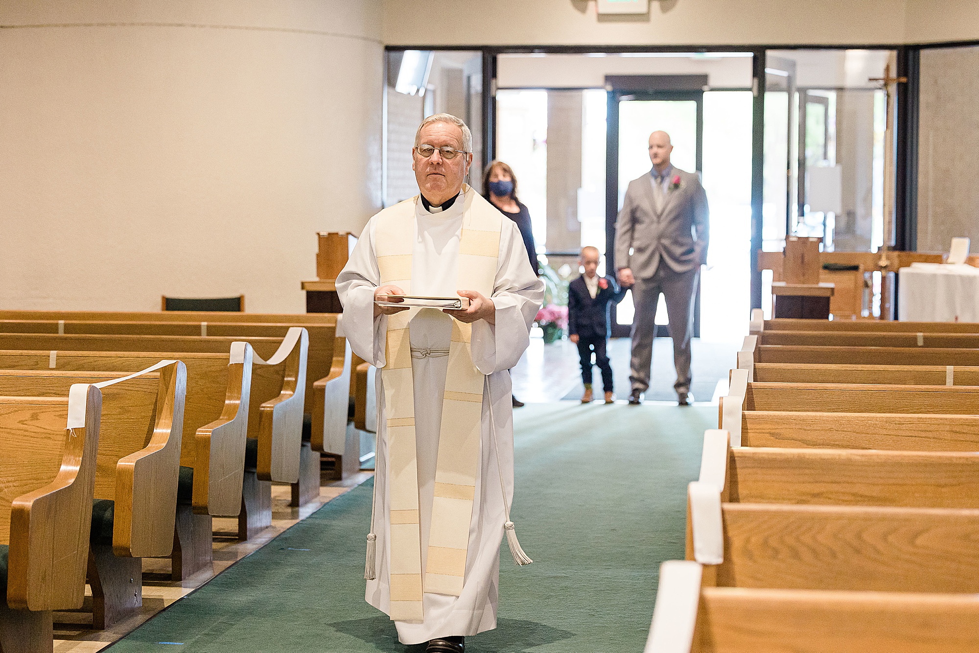 priest walks down aisle for church vow renewal 