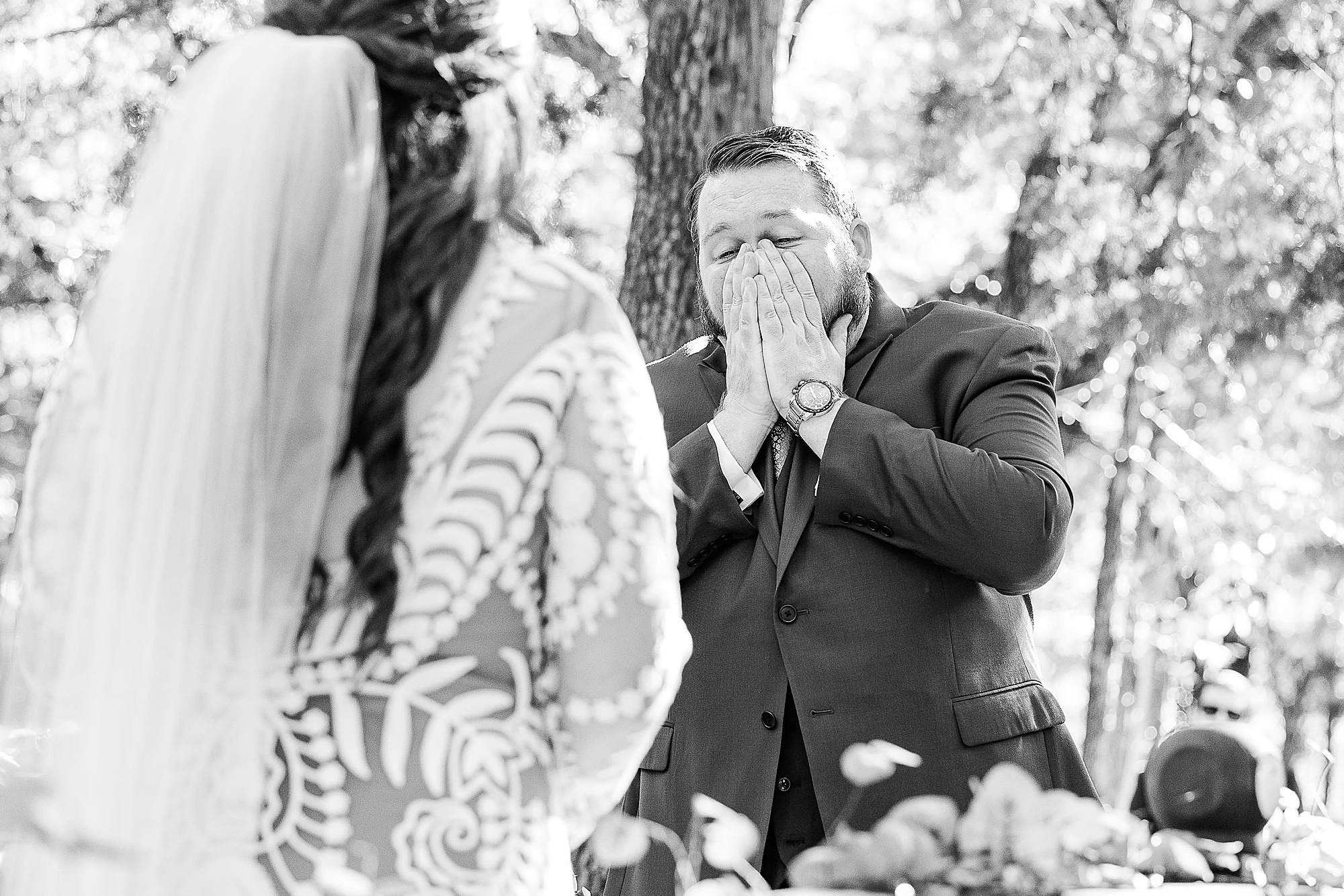 groom surprised during first look at Oak Meadow Ranch