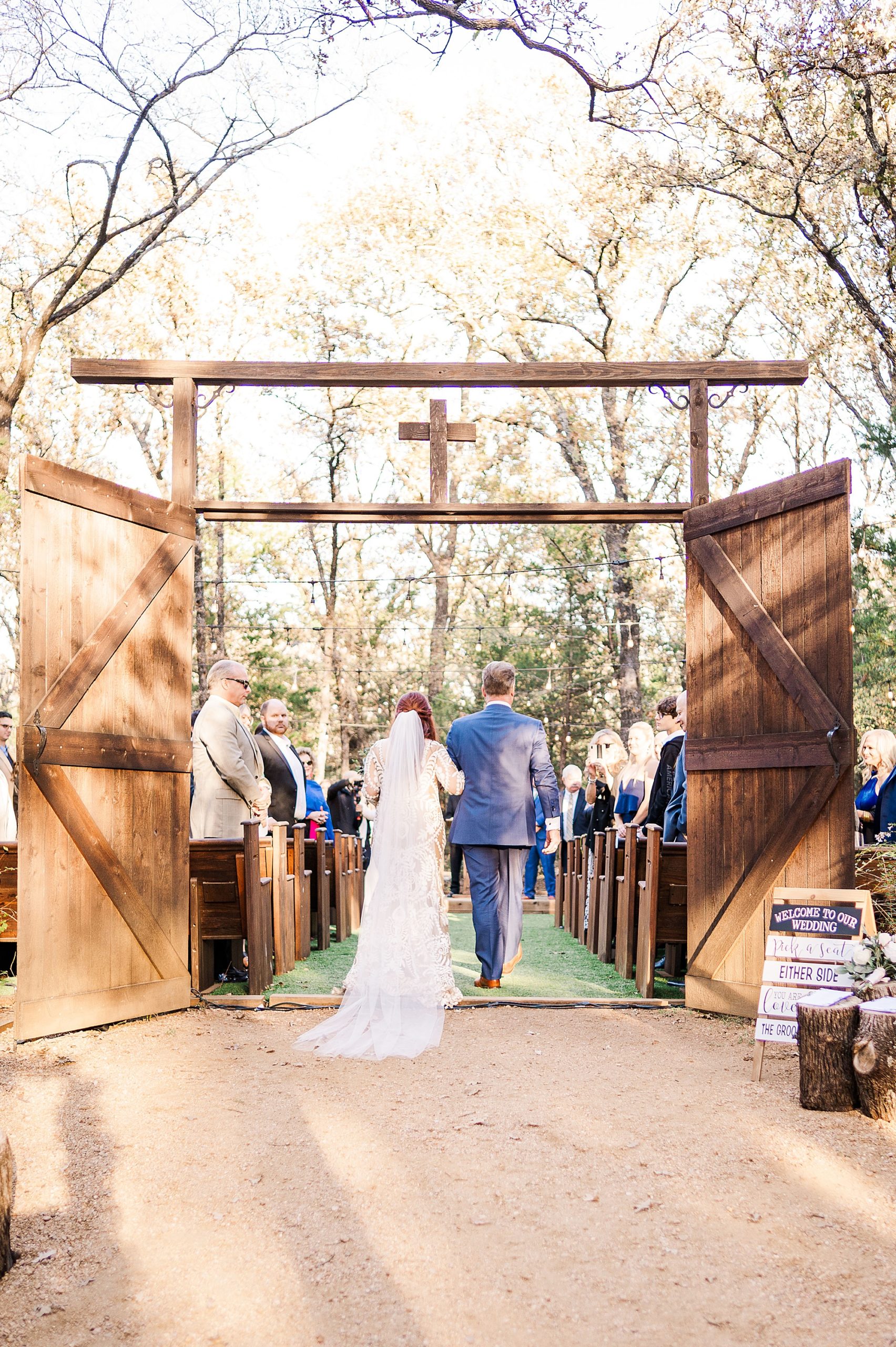 bride walks down aisle with brother during Valley View TX wedding day