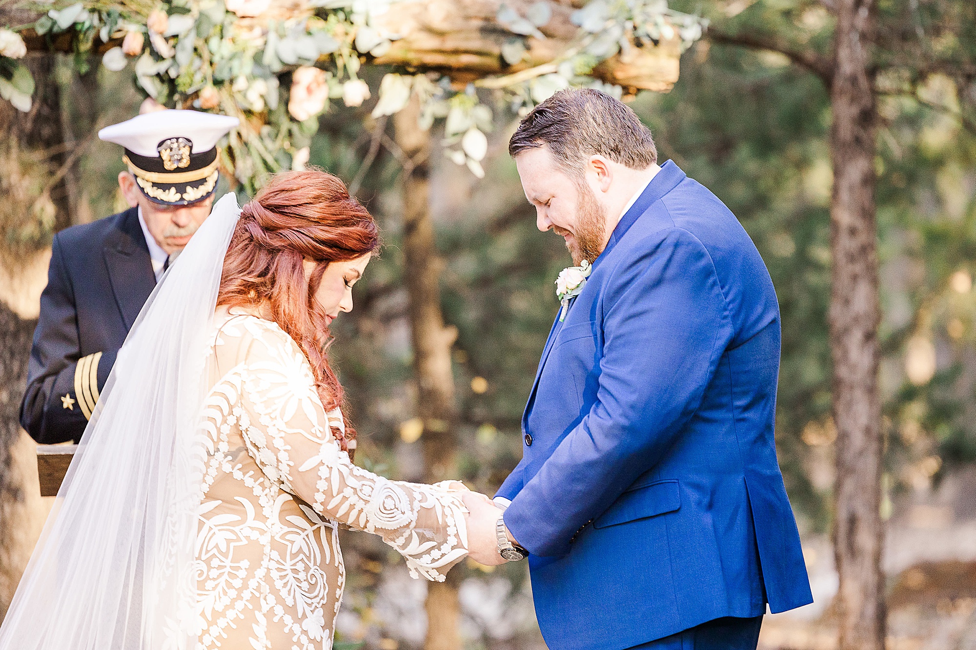 bride and groom hold hands during outdoor wedding ceremony in Texas