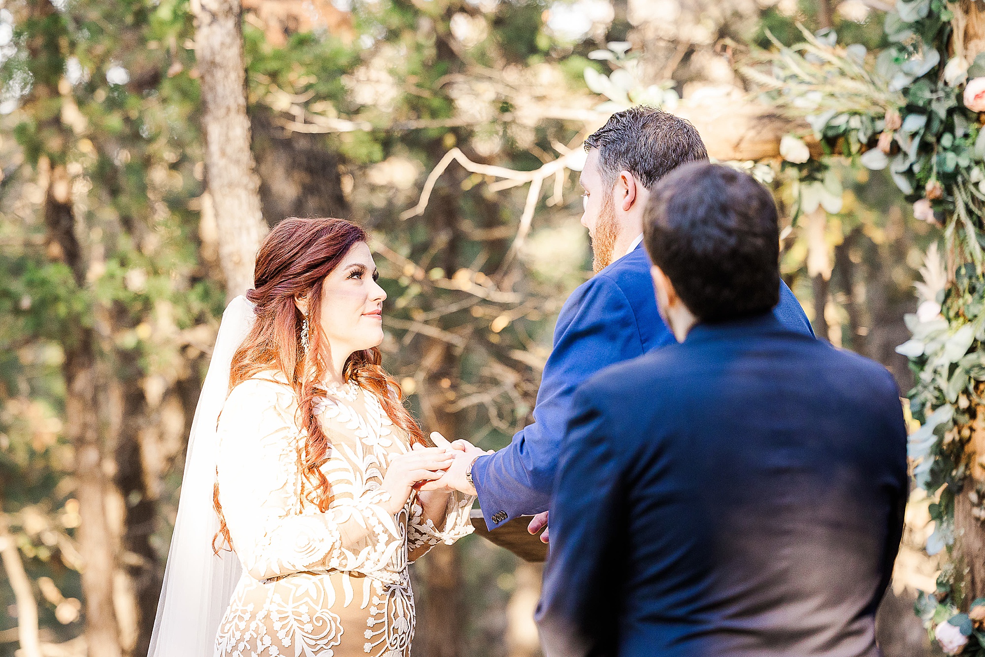 bride and groom exchange vows during outdoor wedding ceremony in Texas