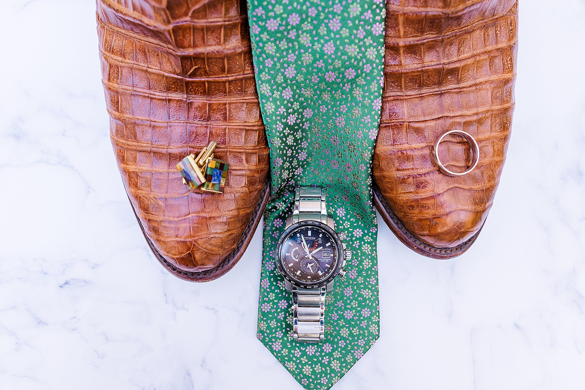 groom's details for TX wedding day including green tie and brown cowboy boots