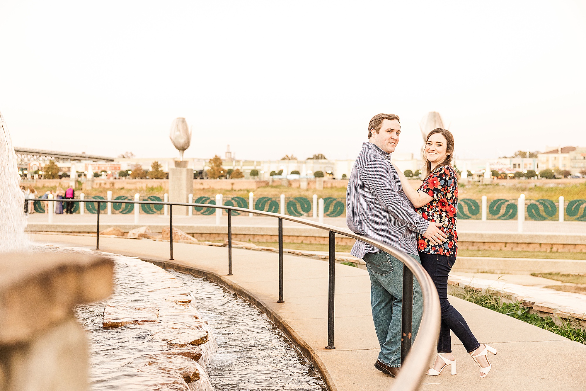 urban Shreveport engagement session by fountain for engaged couple
