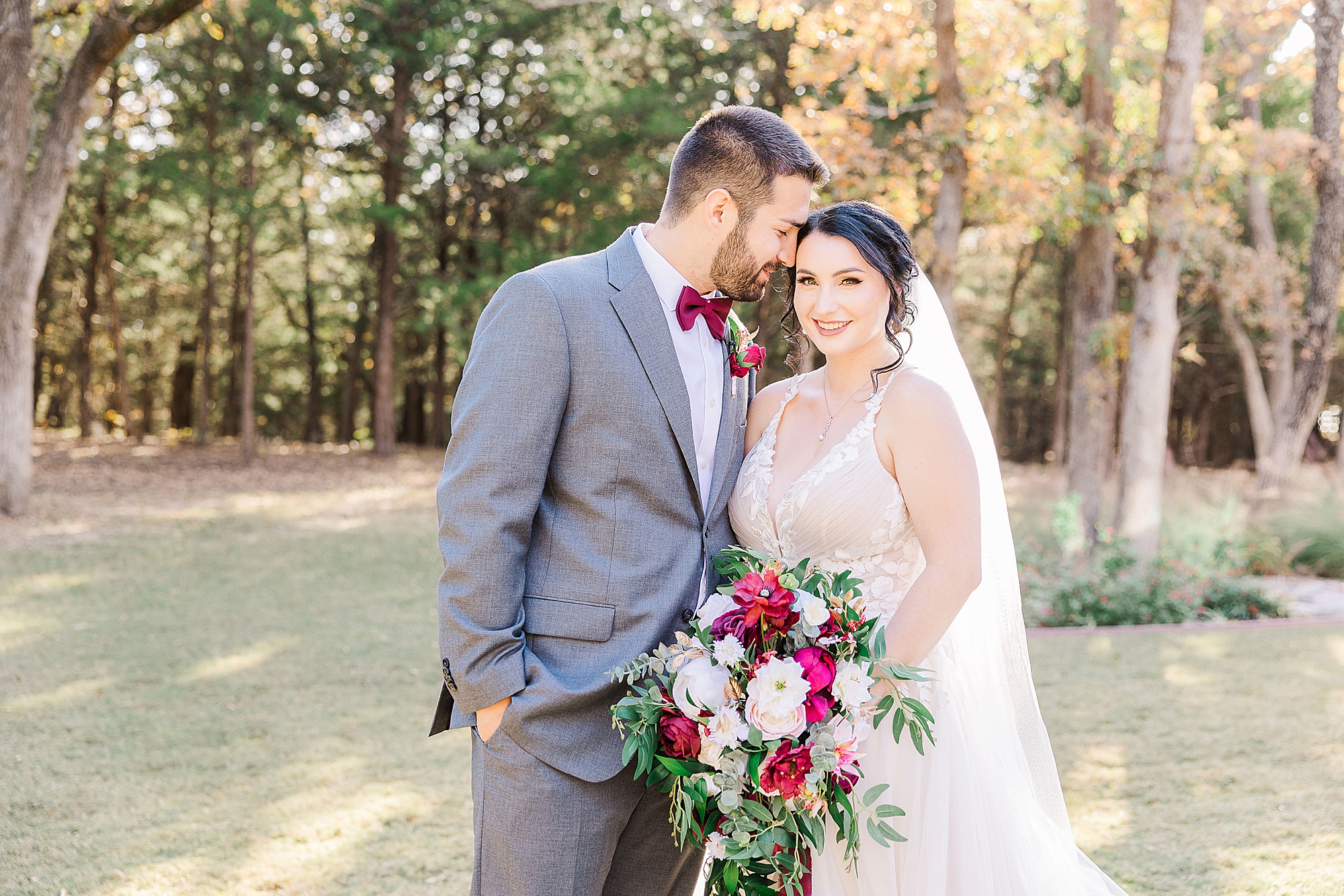 Whispering Oaks wedding day with red and white details photographed by Texas wedding photographer Abbie Road Photography
