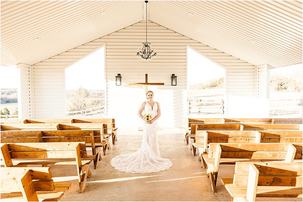 bride in white open air chapel at stand-alone bridal session
